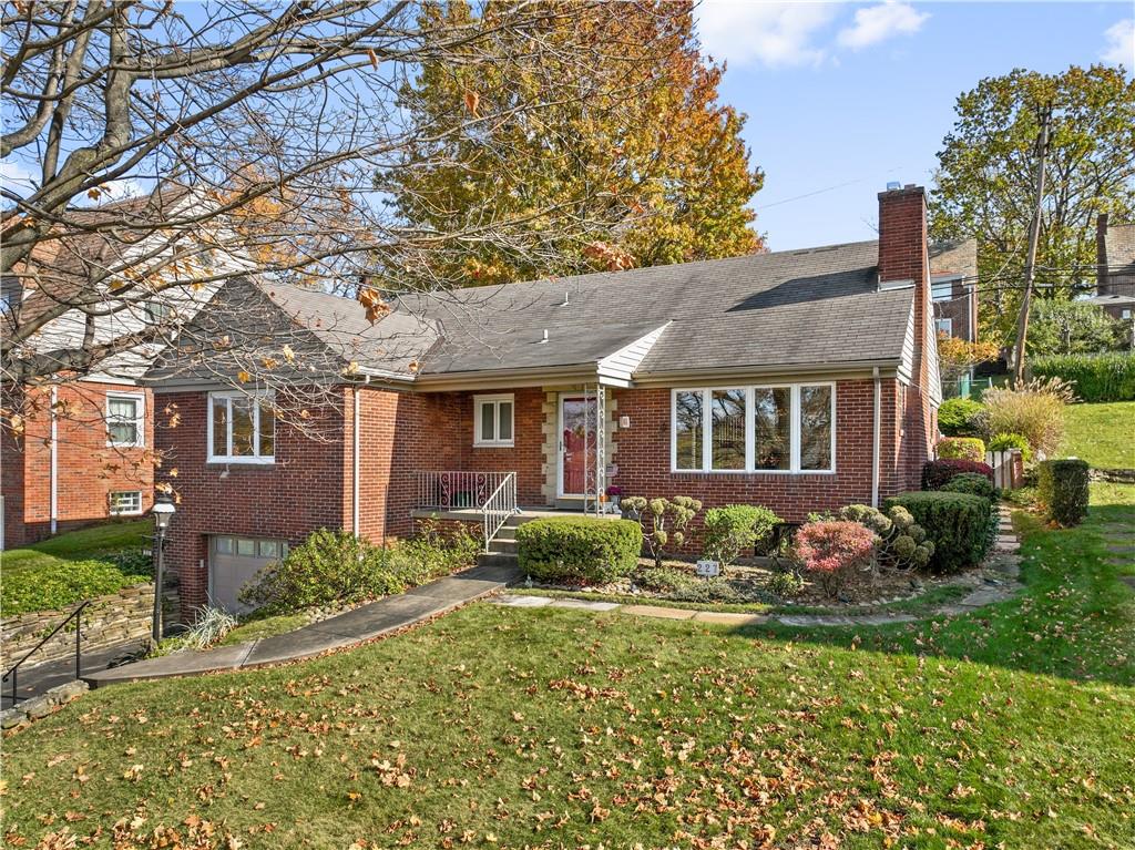 227 Old Clairton Road Pittsburgh, PA 15236 - Photo 2 of 22 a front view of a house with garden
