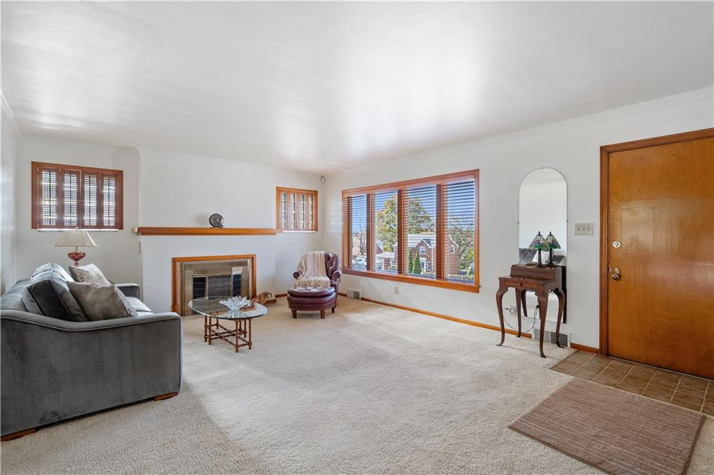 227 Old Clairton Road Pittsburgh, PA 15236 - Photo 4 of 22 a living room with furniture and a fireplace