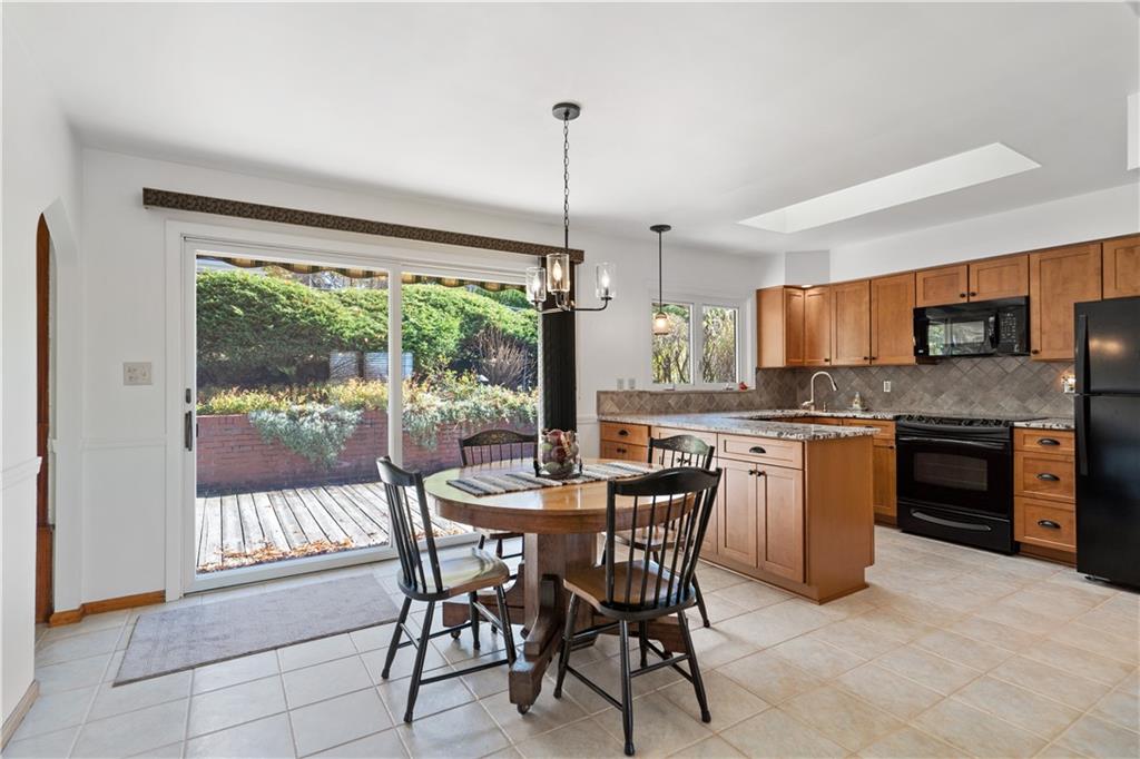 227 Old Clairton Road Pittsburgh, PA 15236 - Photo 5 of 22 a view of a dining room with furniture window and outside view
