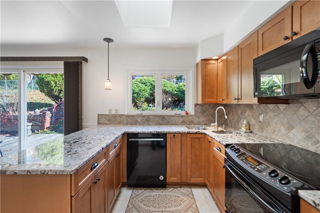 227 Old Clairton Road Pittsburgh, PA 15236 - Photo 8 of 22 a kitchen with a sink stove top oven and cabinets