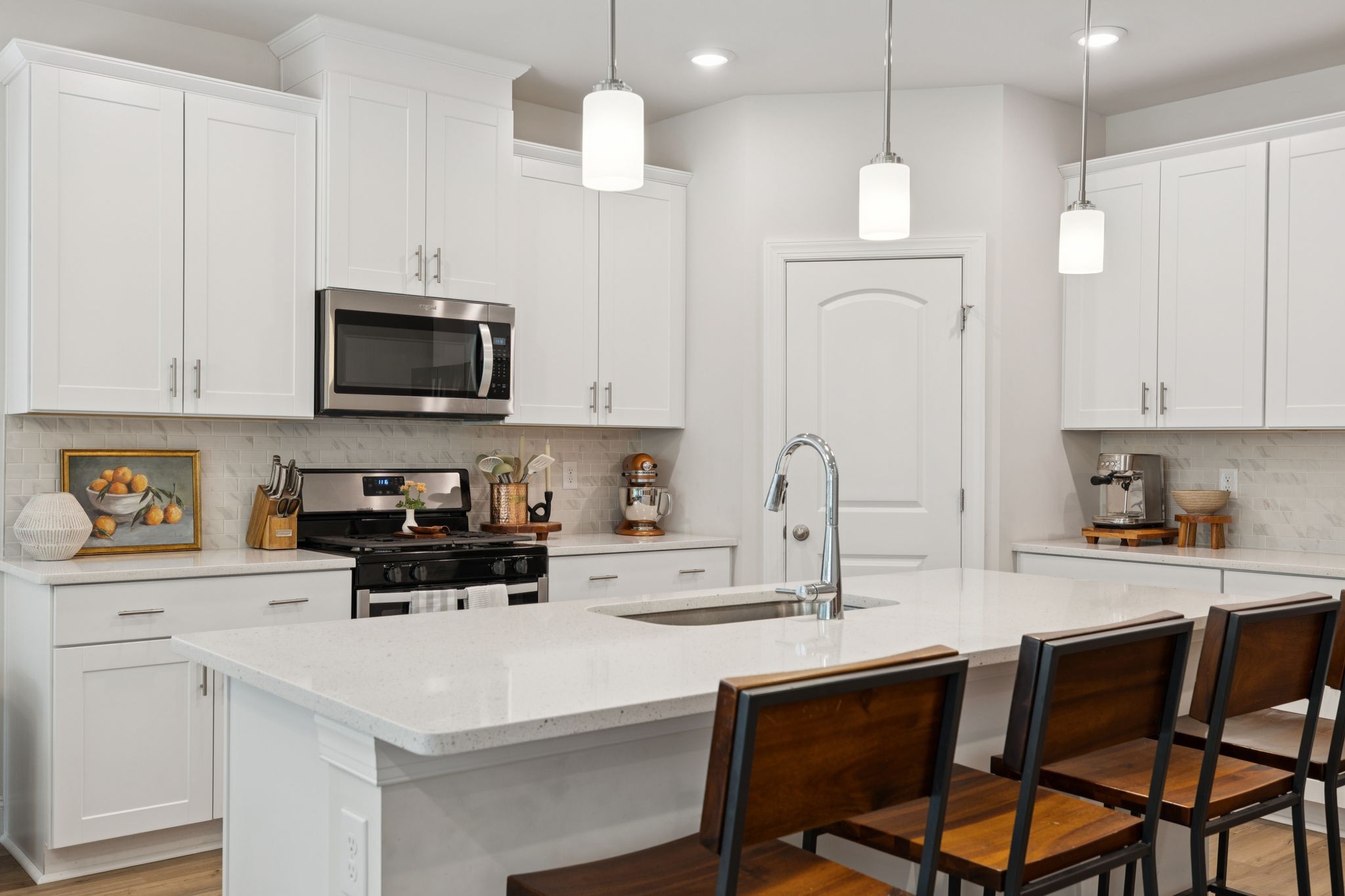 3316 Longstalk Road Antioch, TN 37013 - Photo 12 of 40 a kitchen with stainless steel appliances a stove a sink and white cabinets