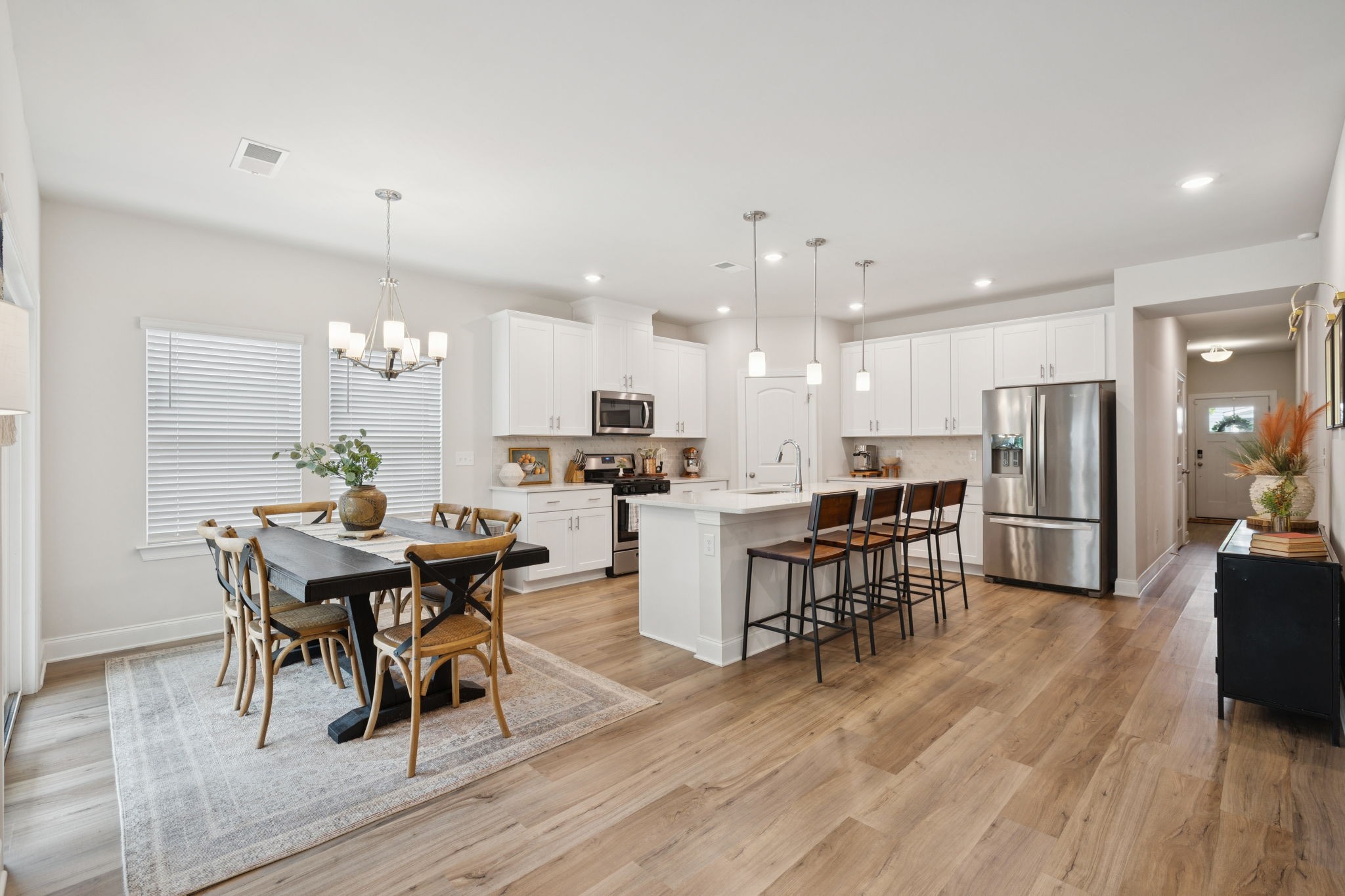 3316 Longstalk Road Antioch, TN 37013 - Photo 18 of 40 a view of a dining room with furniture and wooden floor