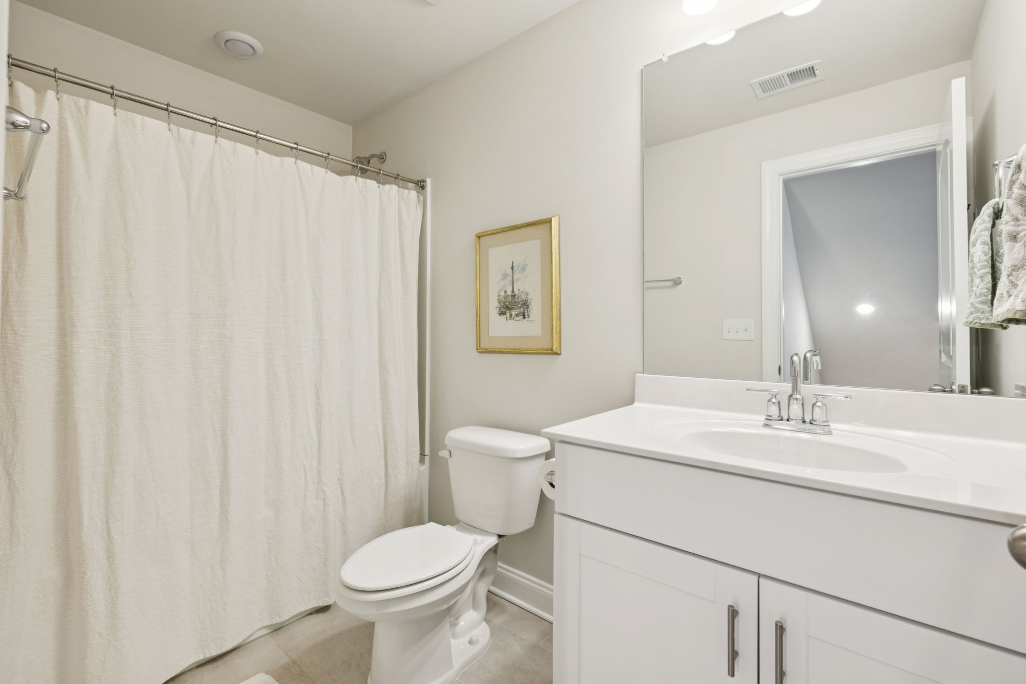 3316 Longstalk Road Antioch, TN 37013 - Photo 28 of 40 a bathroom with a toilet sink and a mirror