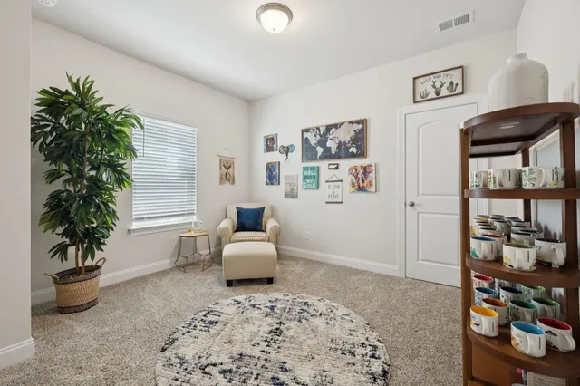 a bedroom with furniture and window