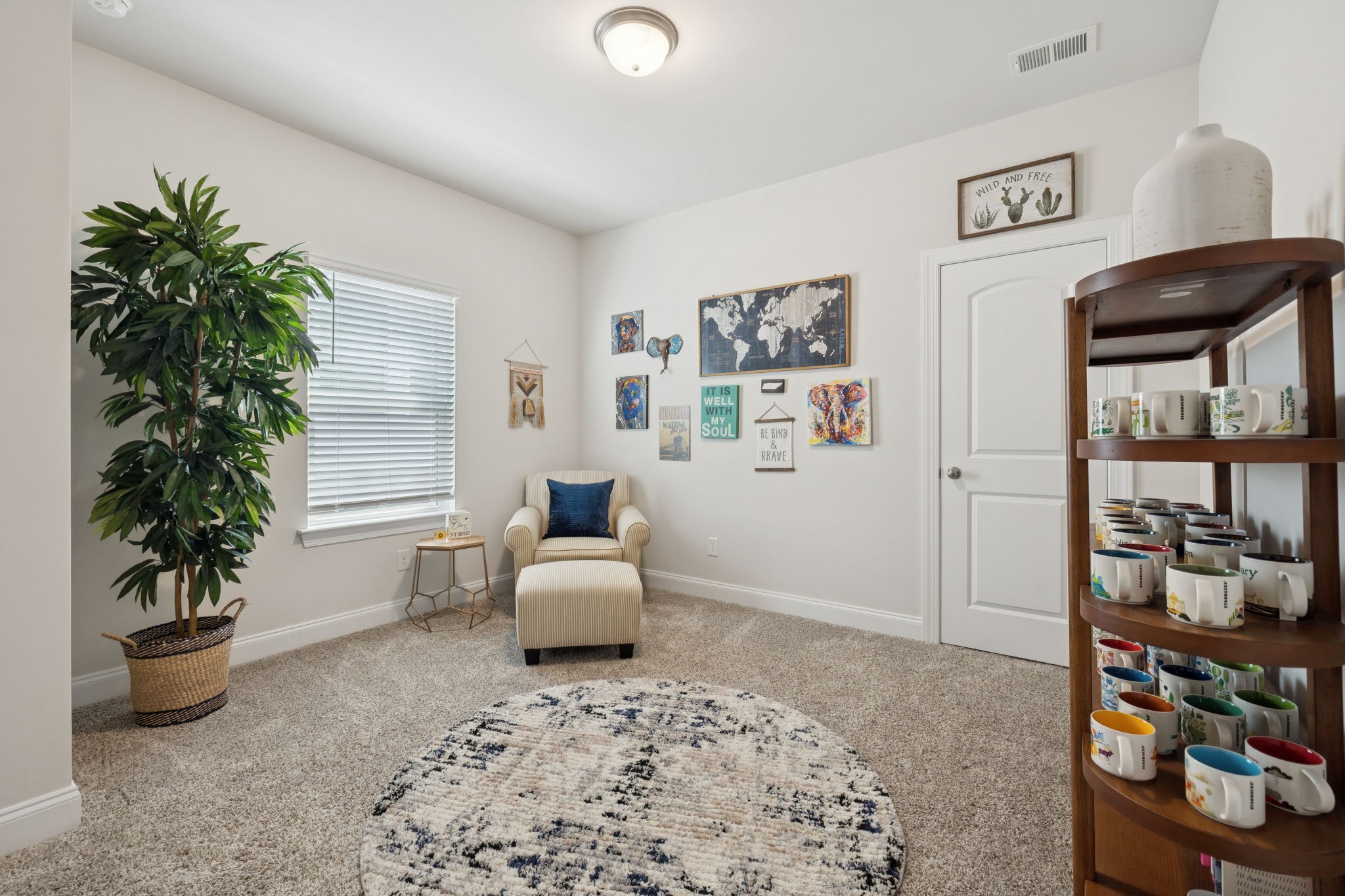 3316 Longstalk Road Antioch, TN 37013 - Photo 33 of 40 a living room with furniture and a potted plant
