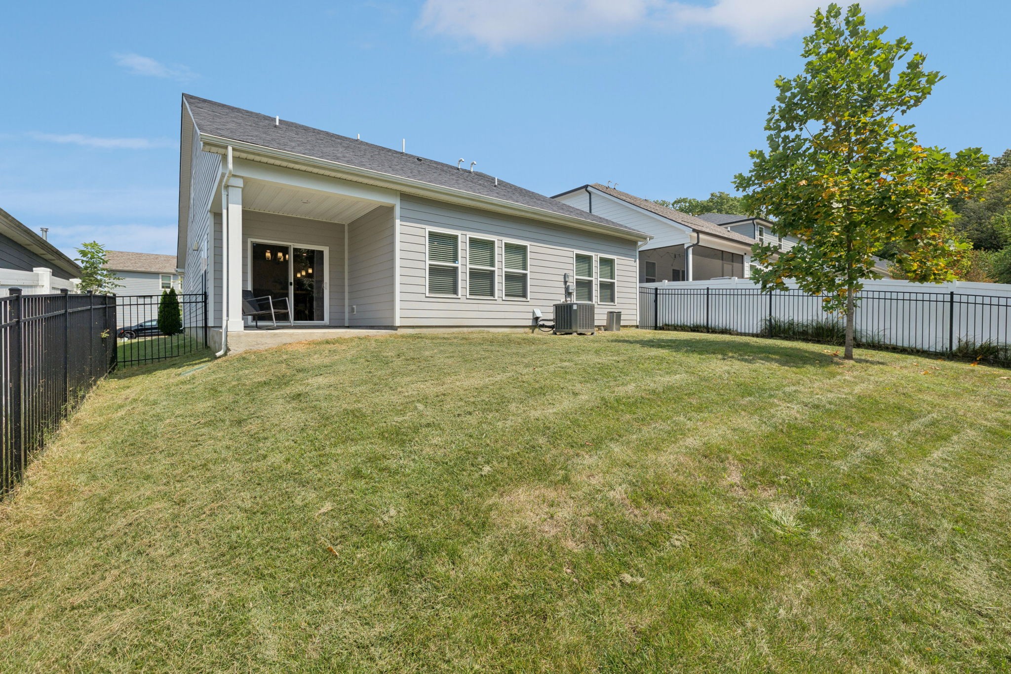 3316 Longstalk Road Antioch, TN 37013 - Photo 38 of 40 a view of a yard in front of a house with a large tree