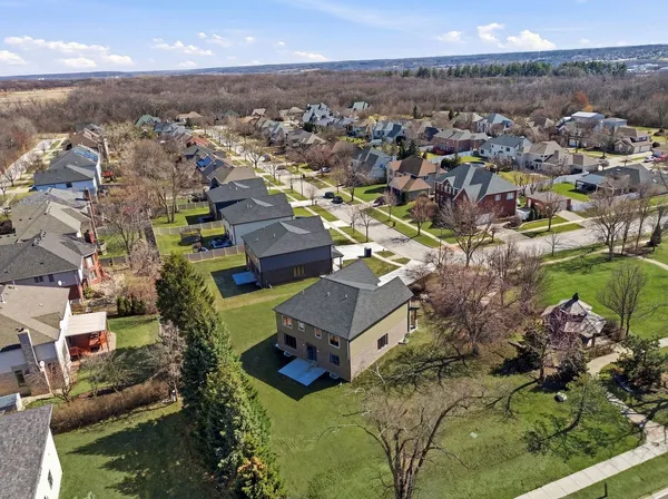 an aerial view of residential houses with outdoor space