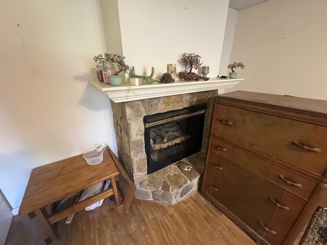 a room with furniture a rug and a window