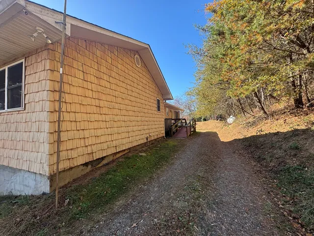 a view of a patio with table and chairs and wooden floor