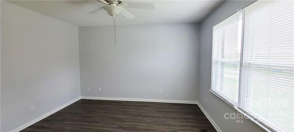 3560 Boggs Road Claremont, NC 28610 - Photo 11 of 15 wooden floor in an empty room with a window