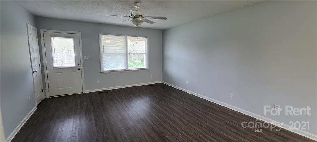 3560 Boggs Road Claremont, NC 28610 - Photo 14 of 15 wooden floor in an empty room with a window