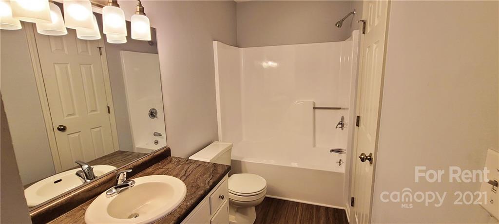3560 Boggs Road Claremont, NC 28610 - Photo 8 of 15 a bathroom with a granite countertop sink toilet and shower