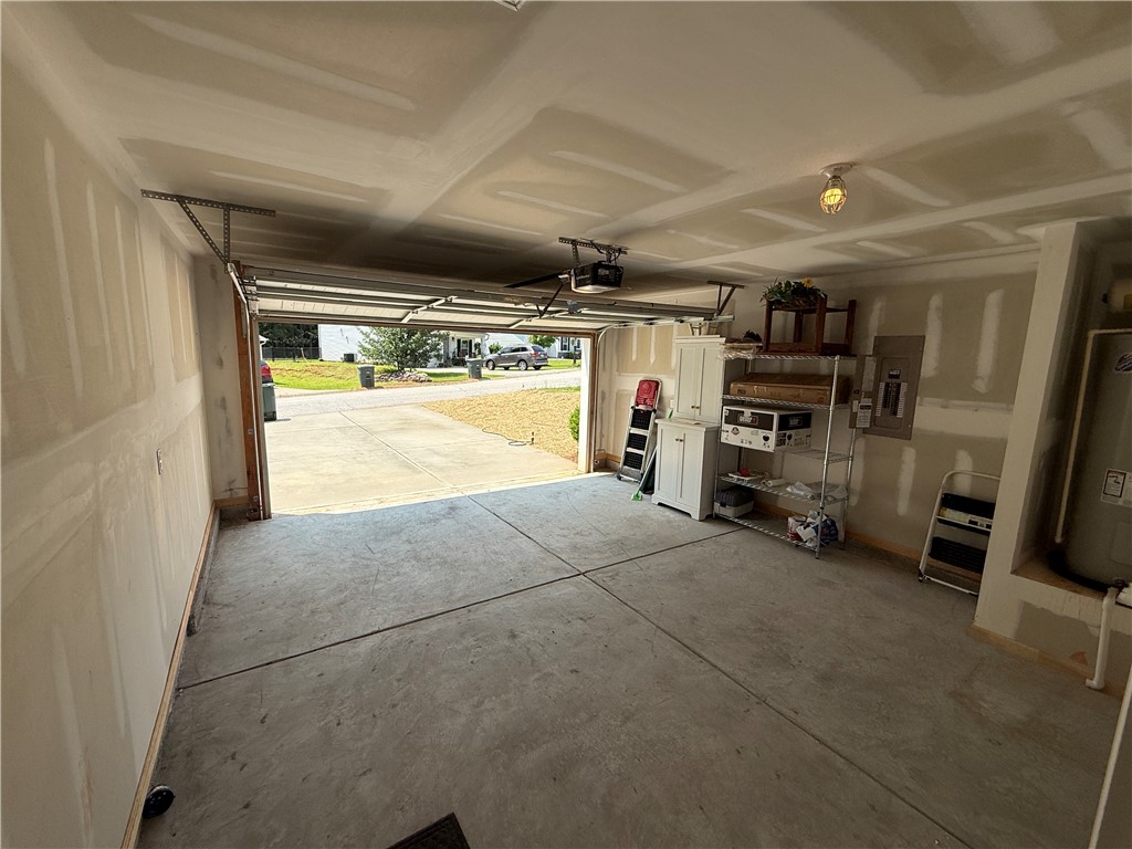 417 Laurel Grove Court Seneca, SC 29678 - Photo 9 of 10 Functional garage space with ample storage, providing convenient access to the outdoors.