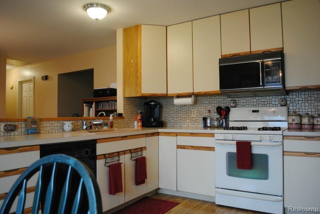 8707 West Van Buren Road Fowlerville, MI 48836 - Photo 3 of 22 Kitchen is open into dining room.