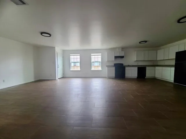 a view of kitchen with furniture and window