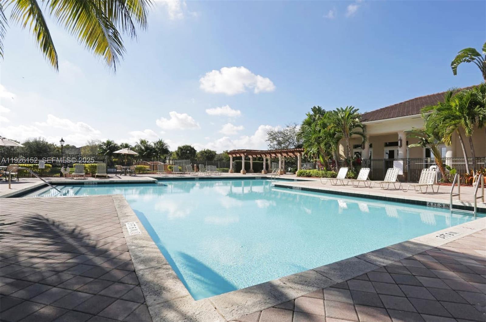 2451 Centergate Drive, Unit 104 Miramar, FL 33025 - Photo 2 of 6 a view of a swimming pool and outdoor space