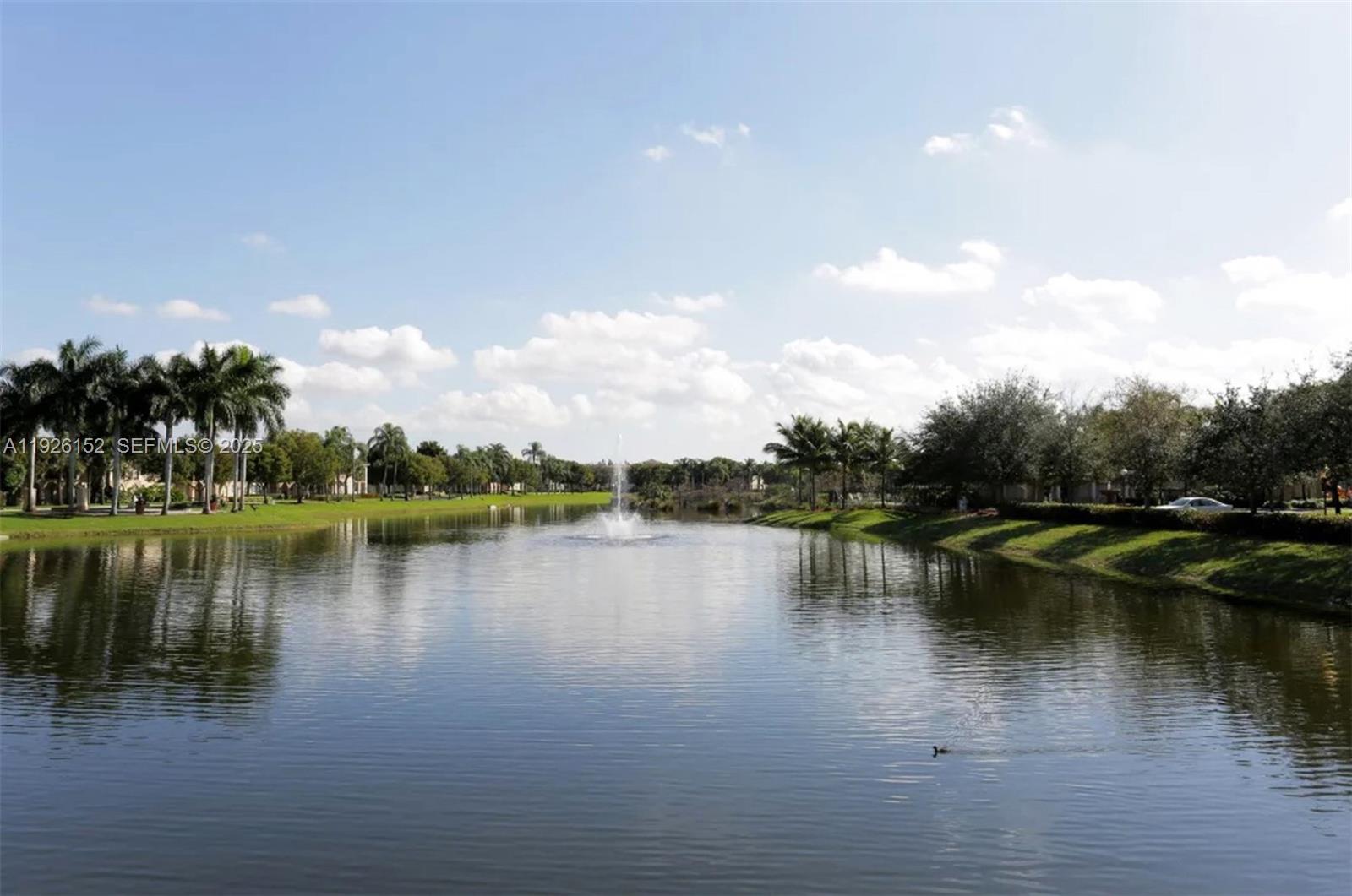 2451 Centergate Drive, Unit 104 Miramar, FL 33025 - Photo 3 of 6 a view of a lake with houses in the back