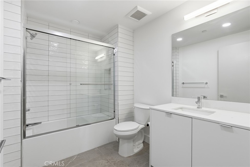 12078 Guerin Street, Unit 101 Studio City, CA 91604 - Photo 9 of 10 a bathroom with a sink toilet and shower
