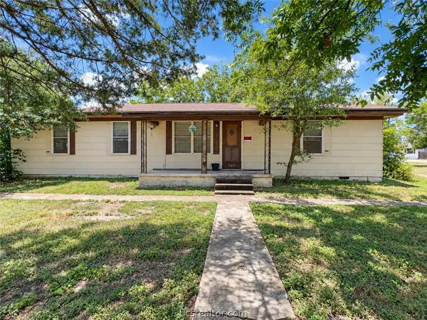 front view of a house with a yard