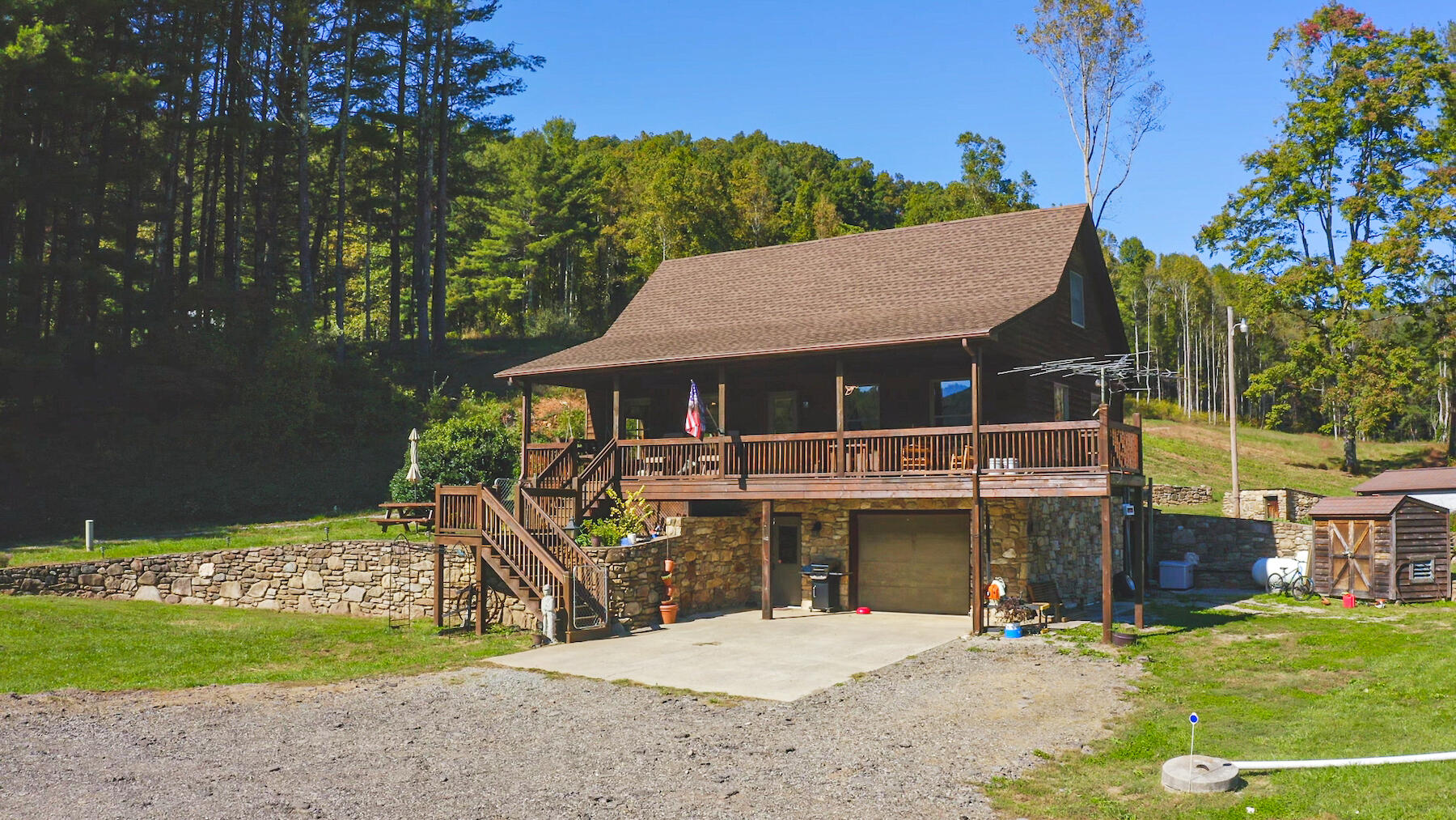 a view of a house with backyard porch and sitting area