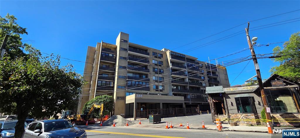 a front view of a building with street view