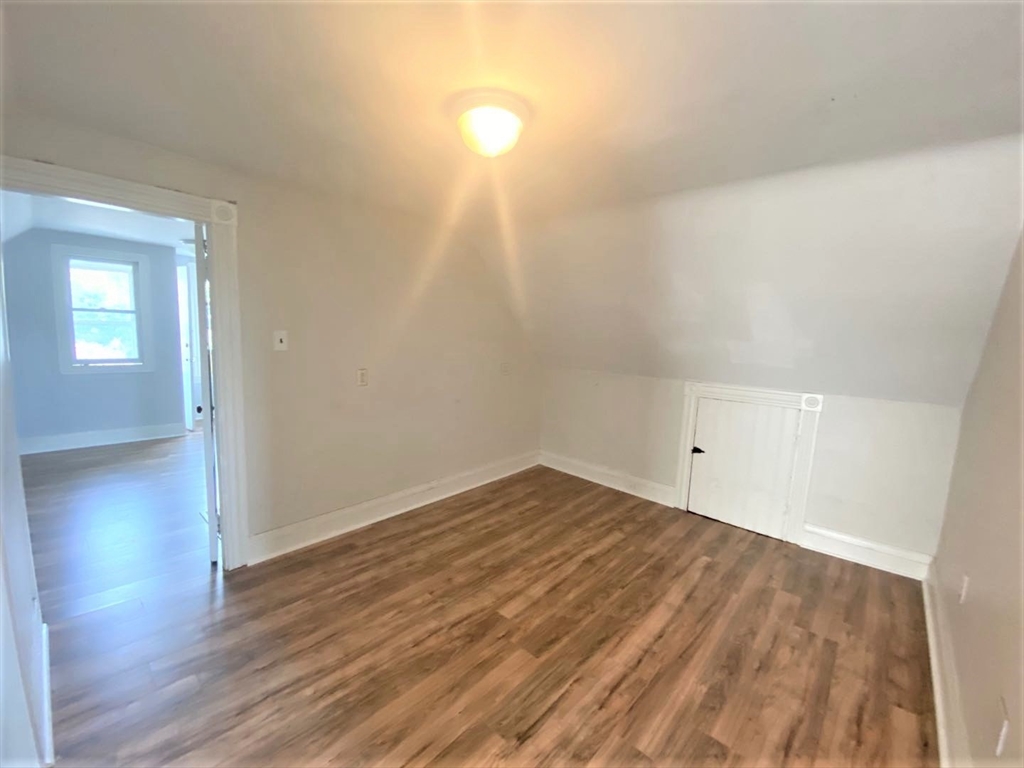 6 Bayard Street Boston, MA 02134 - Photo 11 of 15 a view of empty room with wooden floor