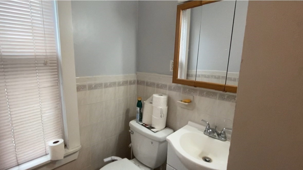 6 Bayard Street Boston, MA 02134 - Photo 12 of 15 a bathroom with a sink and a toilet