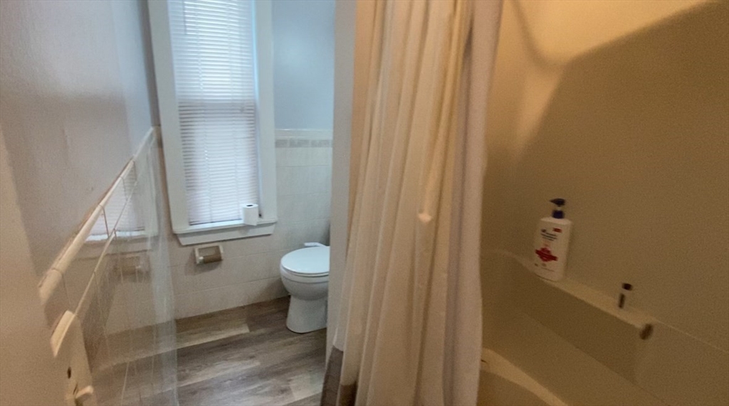 6 Bayard Street Boston, MA 02134 - Photo 13 of 15 a bathroom with a toilet and a shower