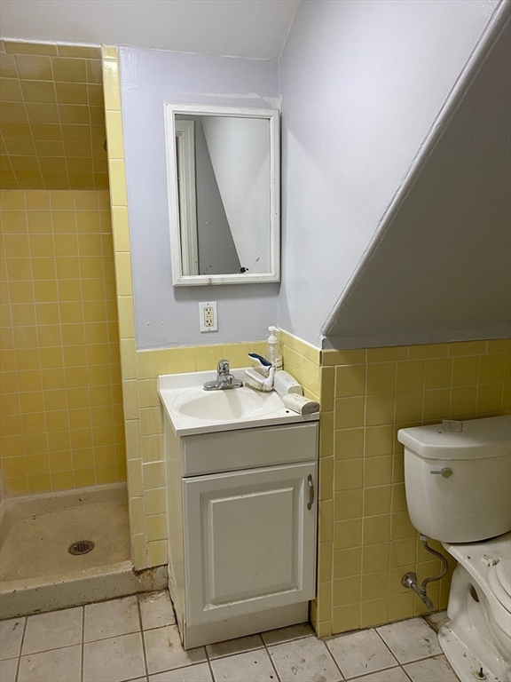 6 Bayard Street Boston, MA 02134 - Photo 14 of 15 a bathroom with a sink a toilet and shower