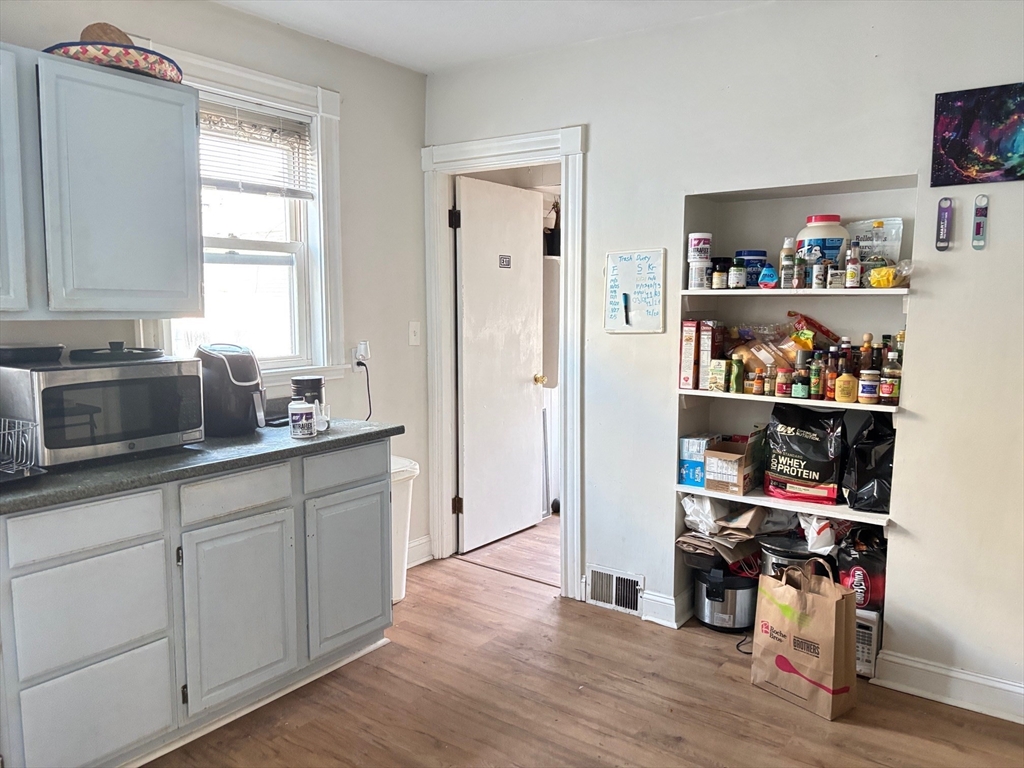 6 Bayard Street Boston, MA 02134 - Photo 5 of 15 a kitchen with cabinets and a window