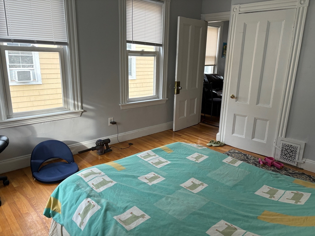 6 Bayard Street Boston, MA 02134 - Photo 6 of 15 a bedroom with a bed and a window