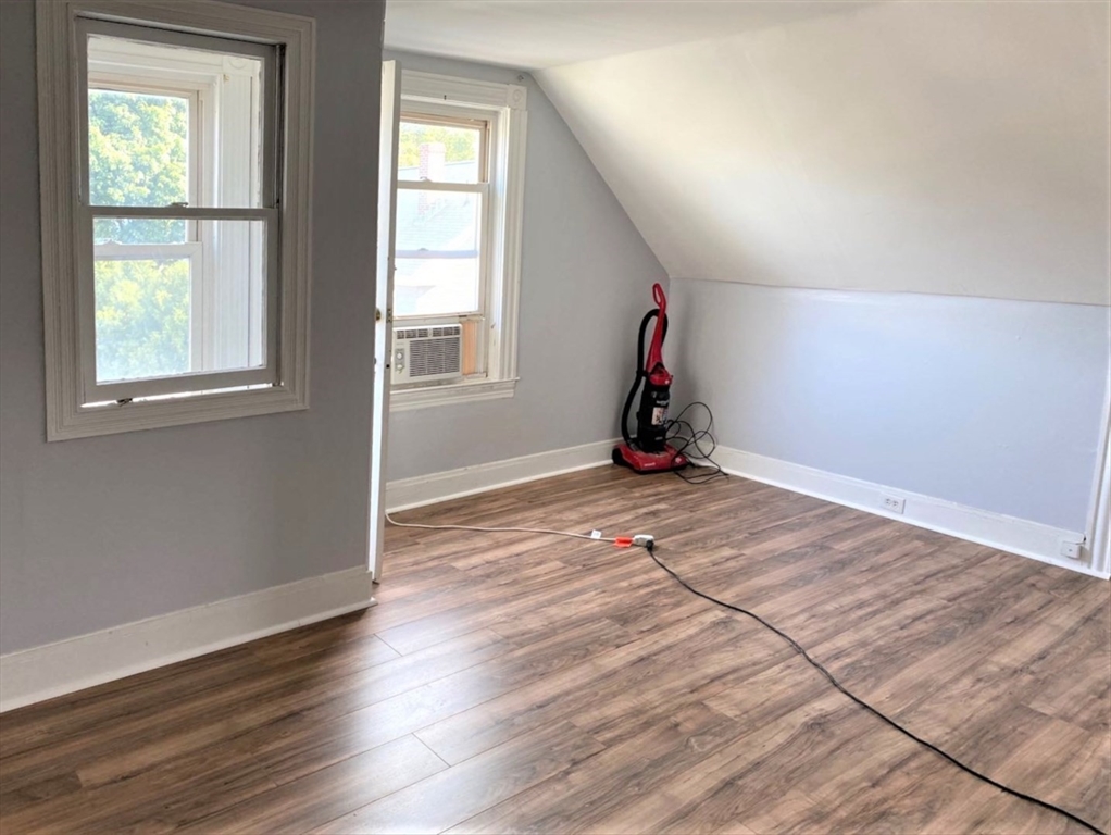 6 Bayard Street Boston, MA 02134 - Photo 10 of 15 a view of a room with wooden floor and windows