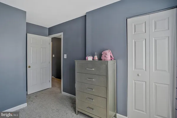 a room with cabinets and dresser
