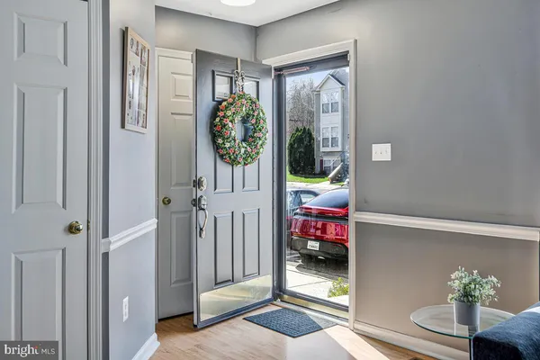 a view of an entryway with wooden floor