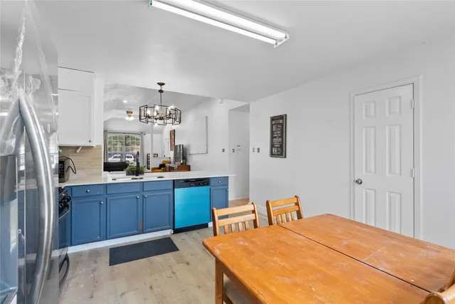 a bed room with a bed and a dresser