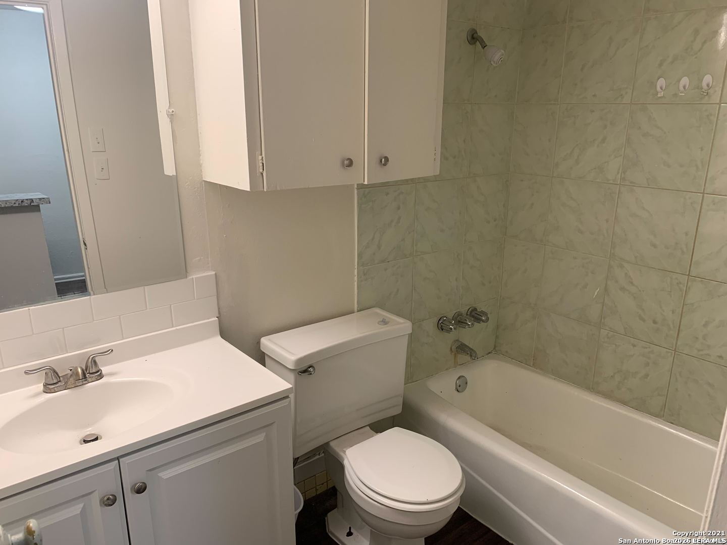 170 De Chantle Road, Unit 503 San Antonio, TX 78201 - Photo 10 of 12 a white toilet sitting next to a bathroom sink