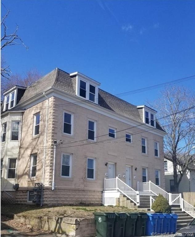 154 Prospect Street, Unit 1 Norwich, CT 06360 - Photo 1 of 1 a front view of a house with a yard
