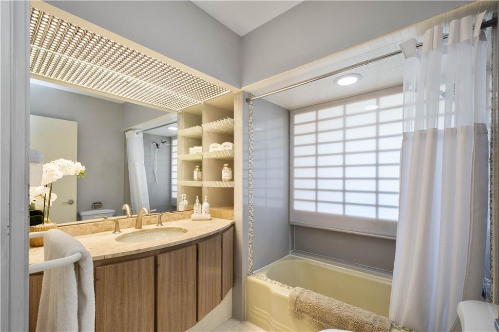 3113 Hillcrest Road Bethel Park, PA 15102 - Photo 24 of 50 a bathroom with a granite countertop sink and a mirror