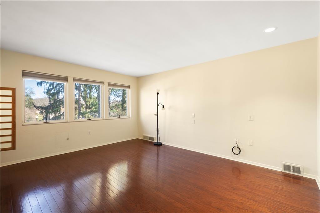 3113 Hillcrest Road Bethel Park, PA 15102 - Photo 25 of 50 an empty room with wooden floor and windows