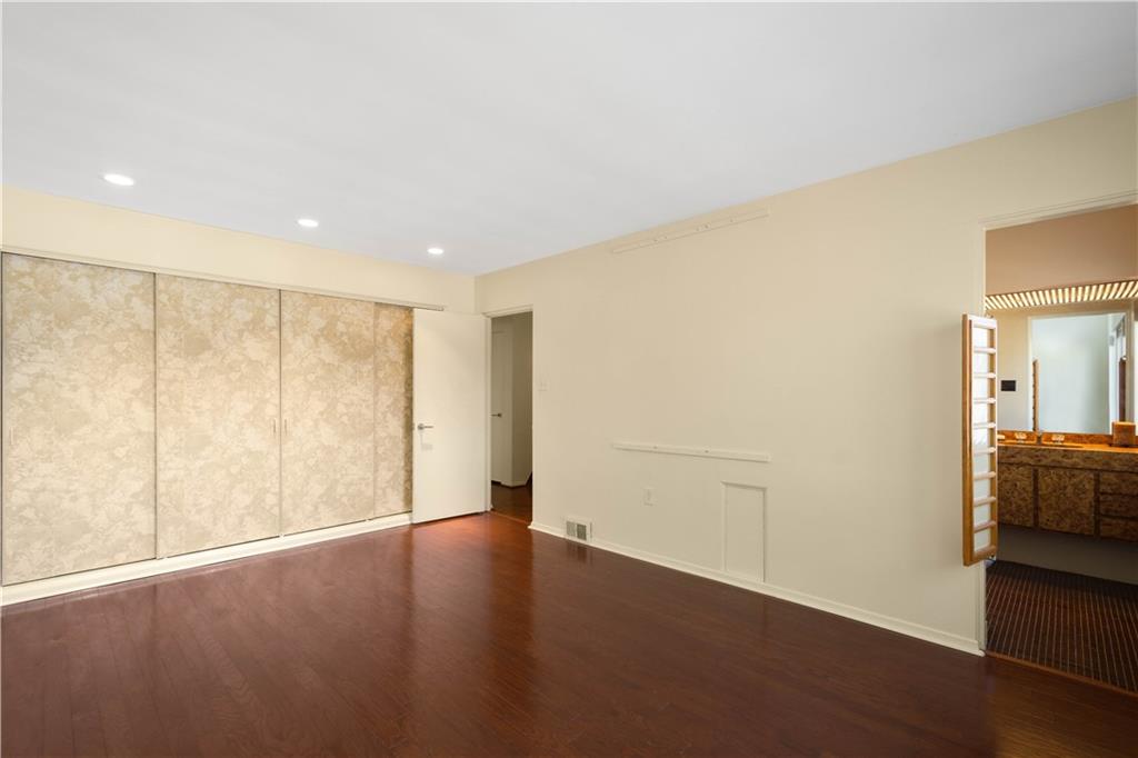 3113 Hillcrest Road Bethel Park, PA 15102 - Photo 27 of 50 an empty room with wooden floor and windows