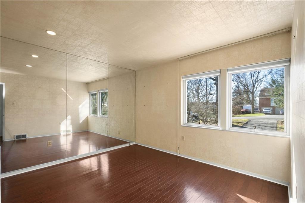 3113 Hillcrest Road Bethel Park, PA 15102 - Photo 29 of 50 a view of an empty room with wooden floor and a window