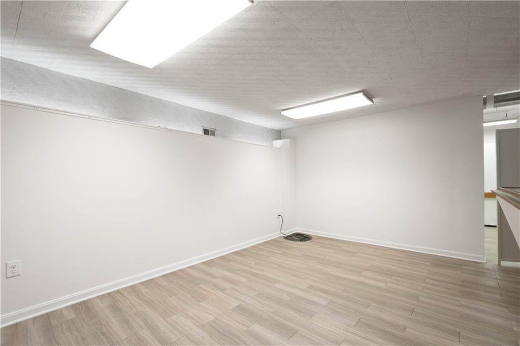 3113 Hillcrest Road Bethel Park, PA 15102 - Photo 40 of 50 a view of an empty room with wooden floor and a window