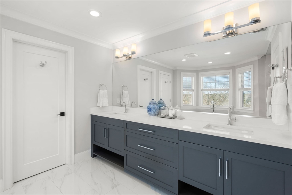 33 Maugus Hill Road Wellesley, MA 02481 - Photo 17 of 34 a bathroom with double vanity sink a mirror a vanity and a shower
