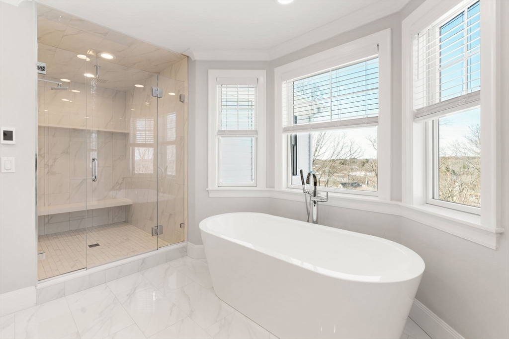 33 Maugus Hill Road Wellesley, MA 02481 - Photo 18 of 34 a white bath tub sitting next to a shower