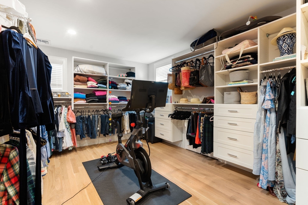 33 Maugus Hill Road Wellesley, MA 02481 - Photo 19 of 34 a view of walk in closet with clothes and shoes
