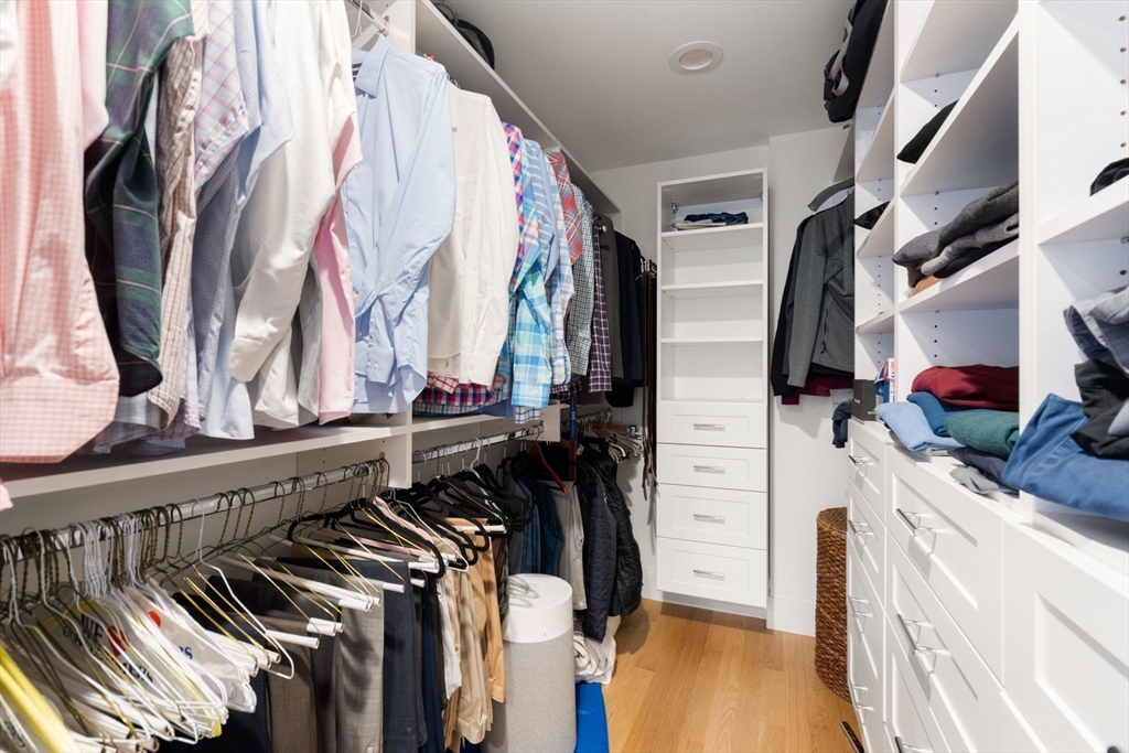 33 Maugus Hill Road Wellesley, MA 02481 - Photo 20 of 34 a view of walk in closet with clothes and shoes