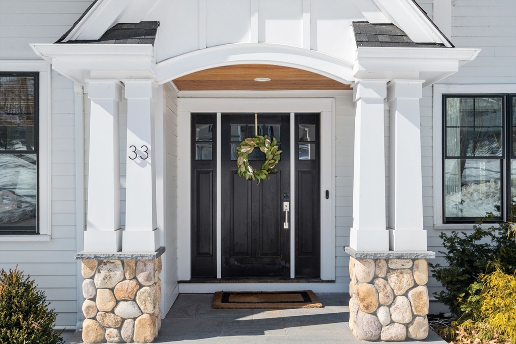 33 Maugus Hill Road Wellesley, MA 02481 - Photo 2 of 34 a front view of a house with a glass windows