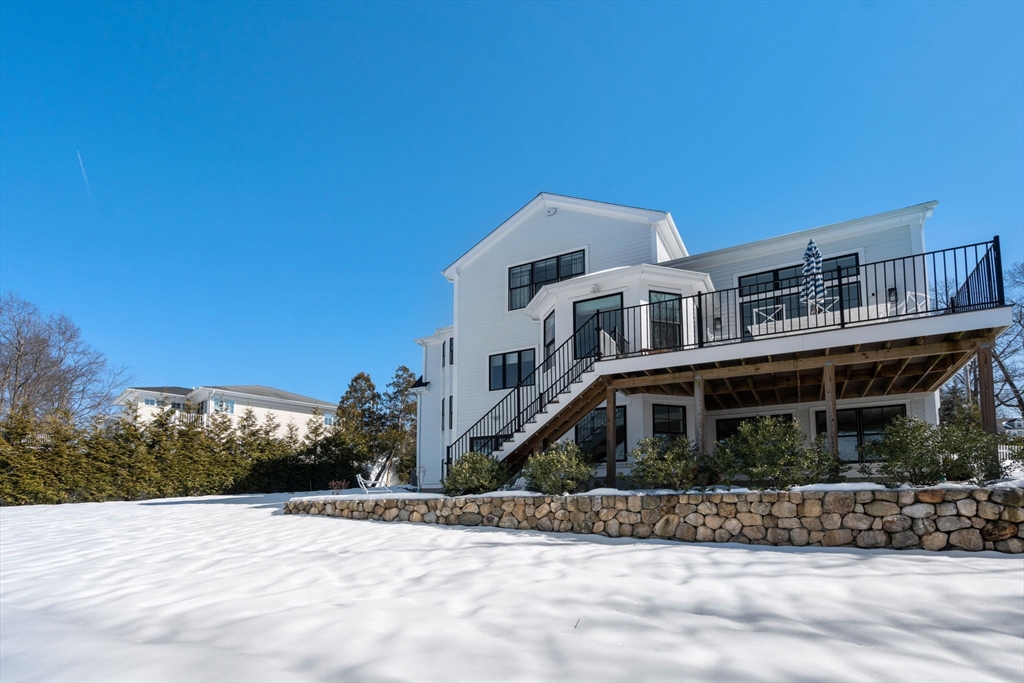 33 Maugus Hill Road Wellesley, MA 02481 - Photo 32 of 34 a front view of a house with a yard