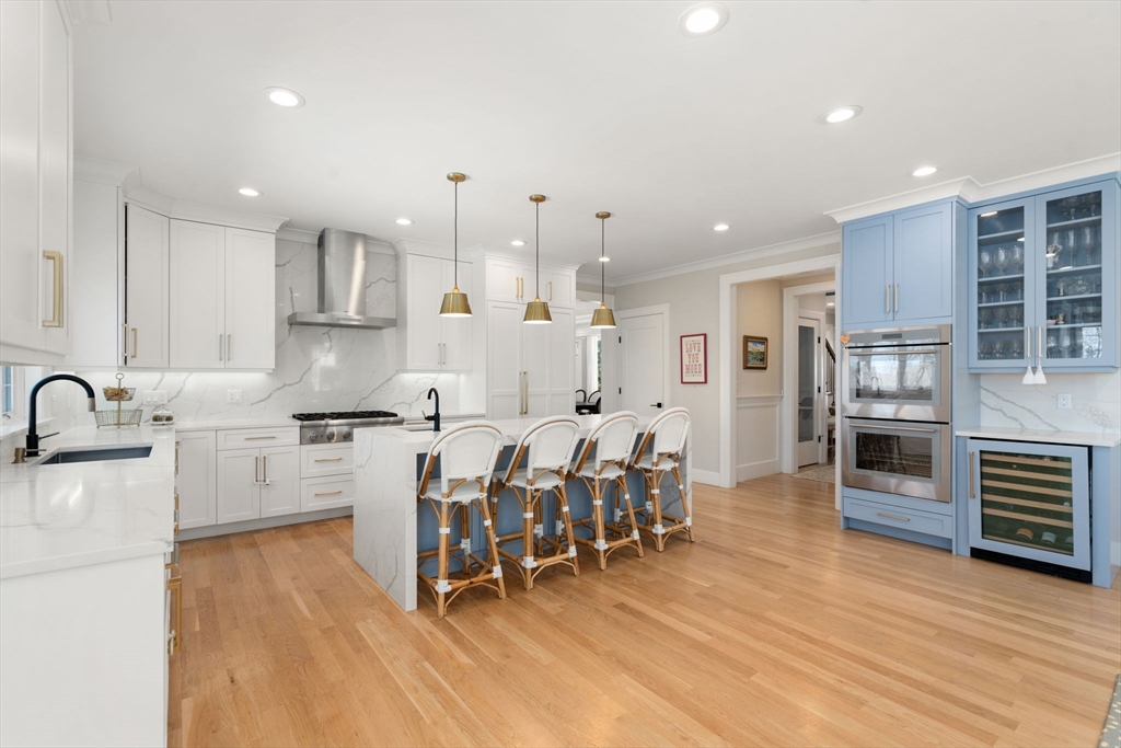 33 Maugus Hill Road Wellesley, MA 02481 - Photo 6 of 34 a large kitchen with lots of counter space wooden floor and appliances