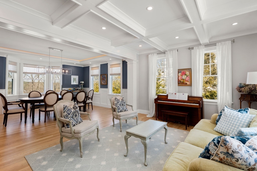 33 Maugus Hill Road Wellesley, MA 02481 - Photo 10 of 34 a living room with furniture potted plant wooden floor and a window